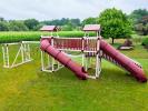 Swing Set with 2 slides, a bridge, monkey bars 2 swings, and a trapeze swing